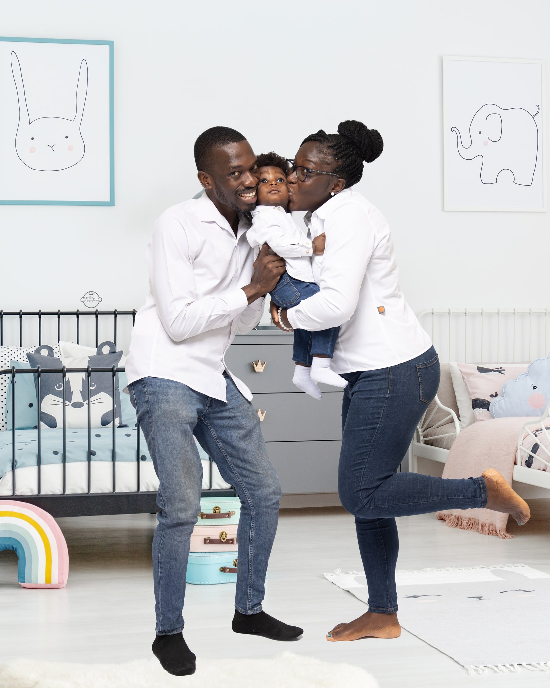 Parents with their baby during a family studio session by Javies Photography Studio